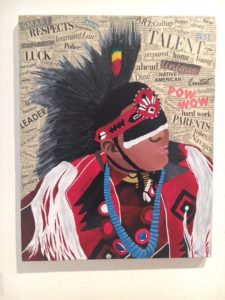 Acrylic portrait of male powwow dancer surrounded by clippings of words from magazines