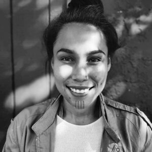 A young woman with a tattooed chin